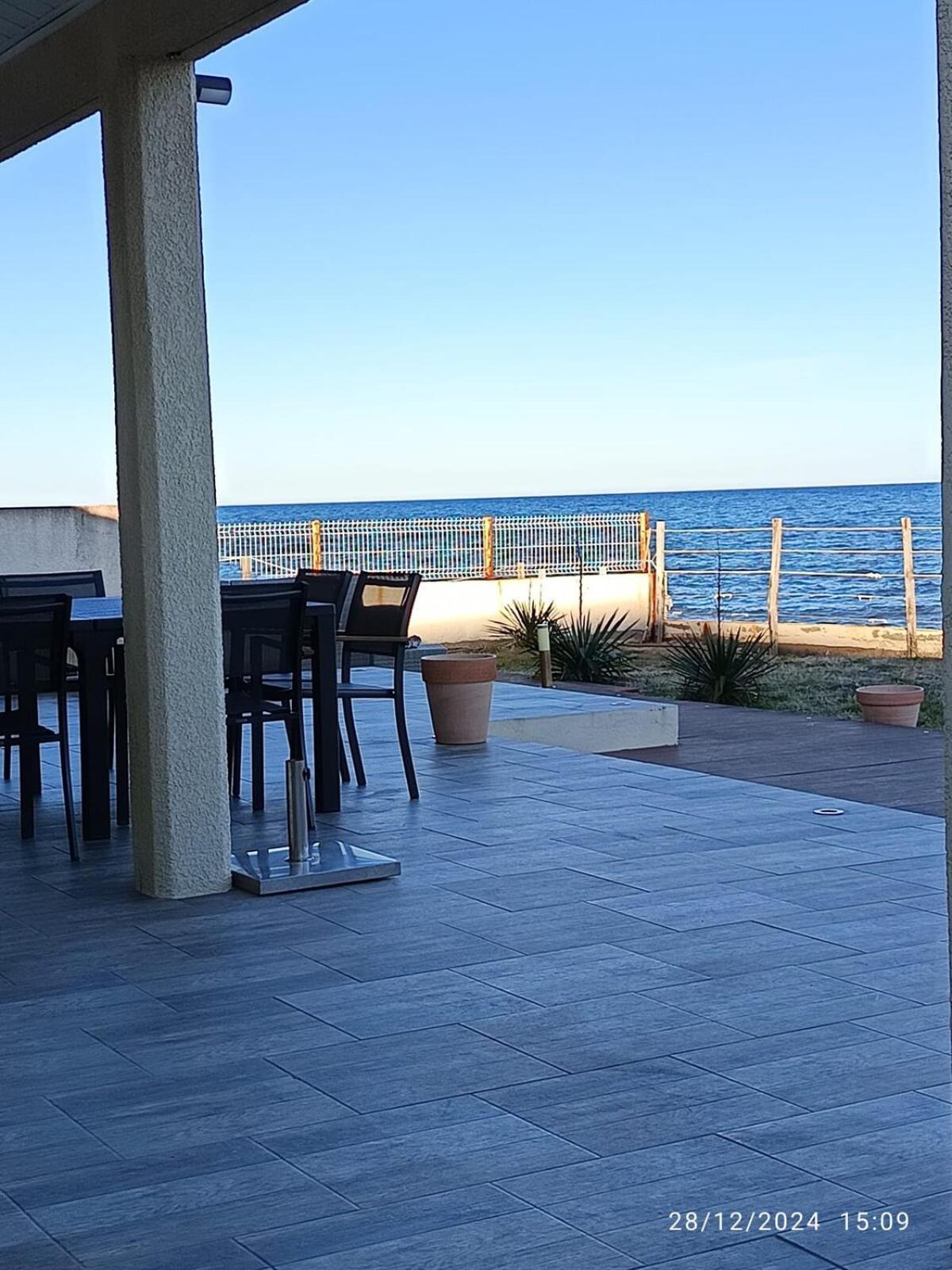 Bord de mer, pieds dans l'eau, vue panoramique Villa San-Nicolao Buitenkant foto